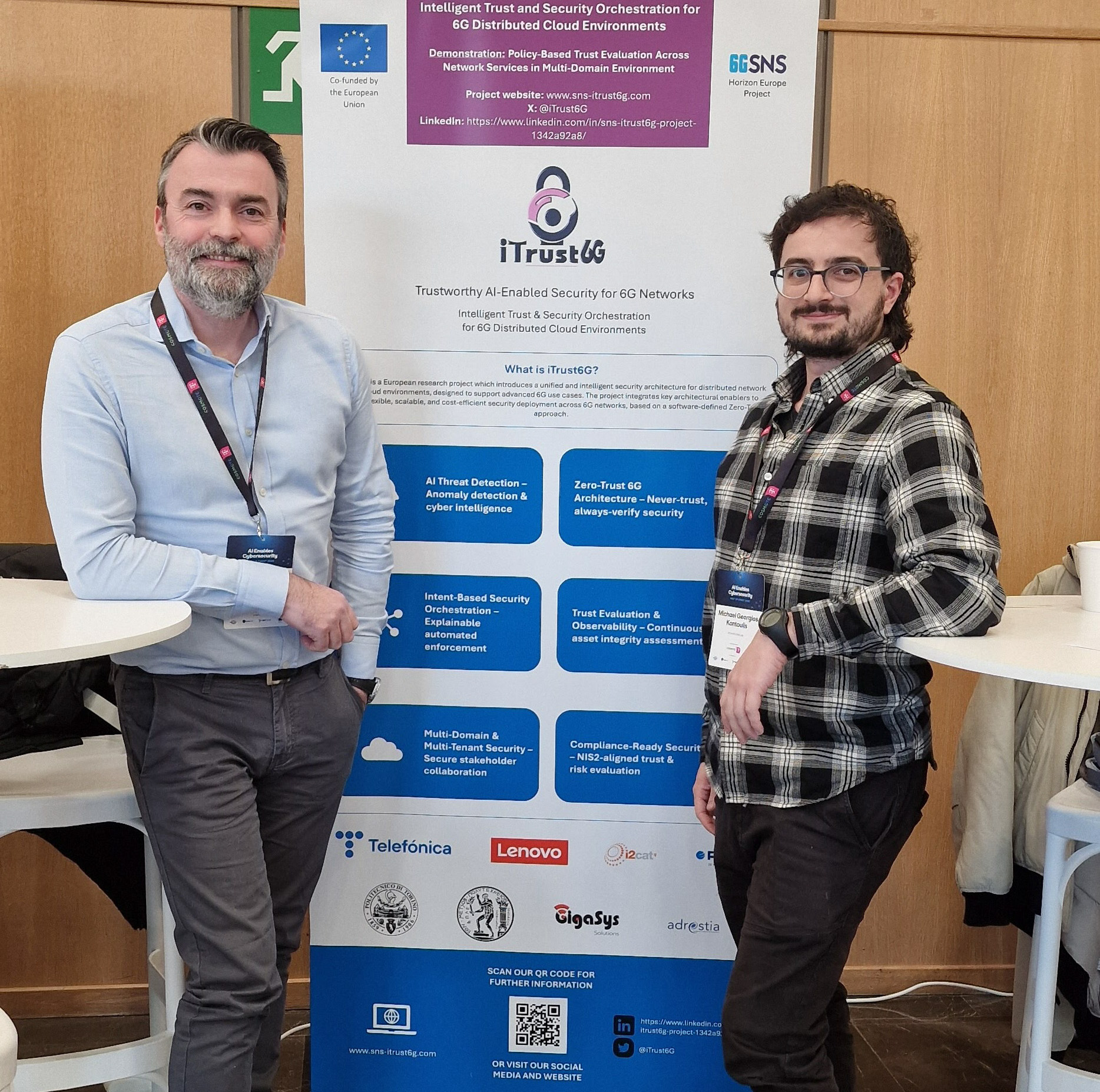 Christos Ntanos and Michael Kontoulis (EPU-NTUA) with the iTrust6G roll-up banner during the event.